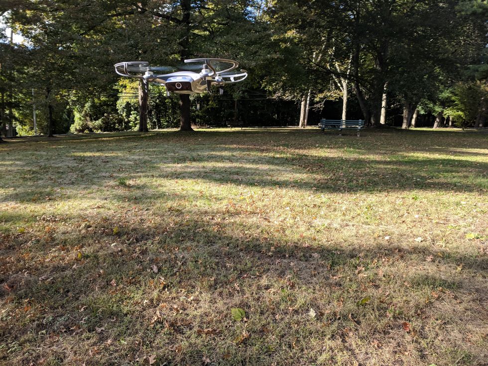 Picture of AEE Mach 1 Drone flying outside in the park