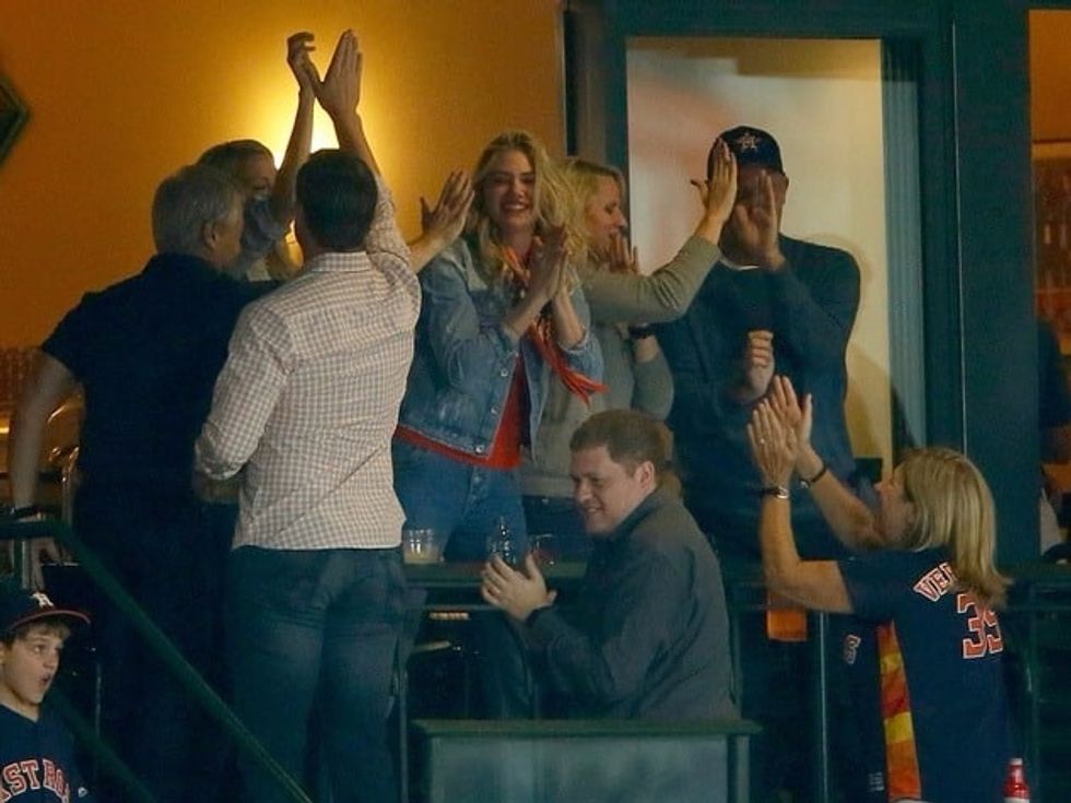 Fan-tastic! Astros fan Kate Upton cheers on her man, Justin Verlander, in big win