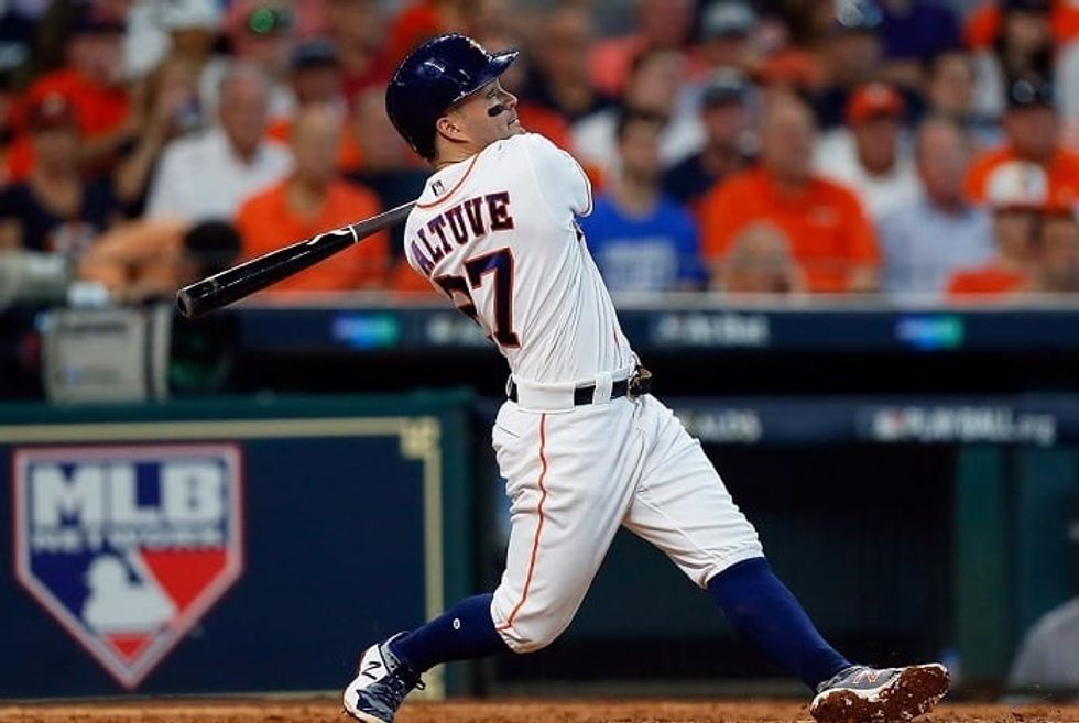 Altuve hits three home runs as Astros take Game 1 from Red Sox 8-2