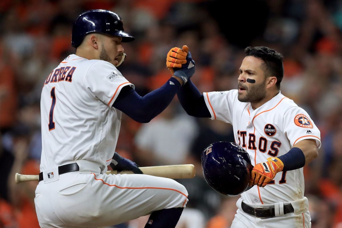 Jose Altuve and Carlos Correa celebrate.