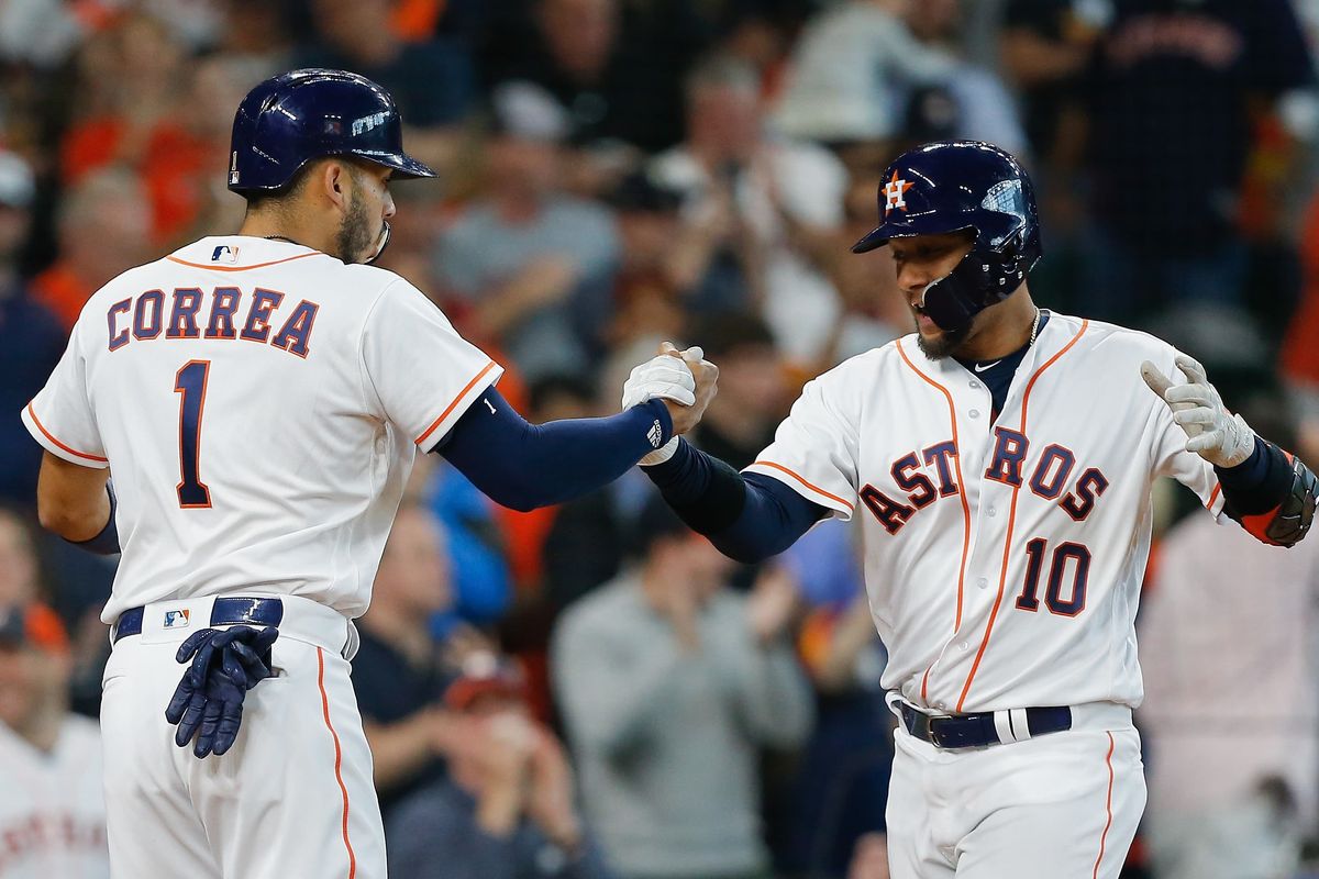 Astros Carlos Correa (left) and Yuli Gurriel (right)