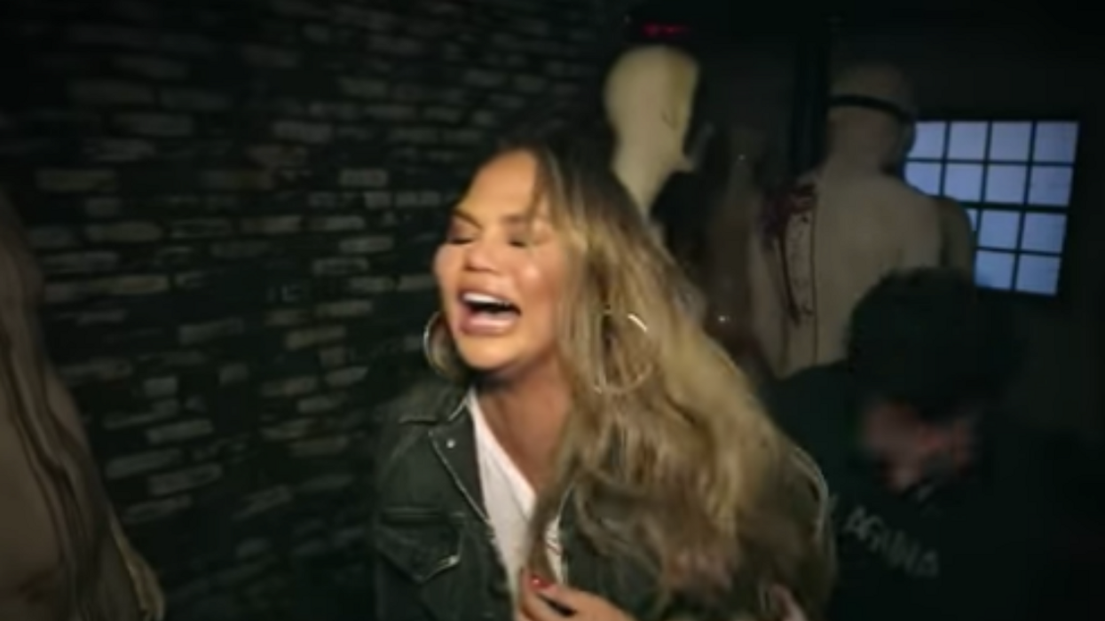 Chrissy Teigen Freaking Out In A Creepy Haunted House Has Us All In The Halloween Spirit