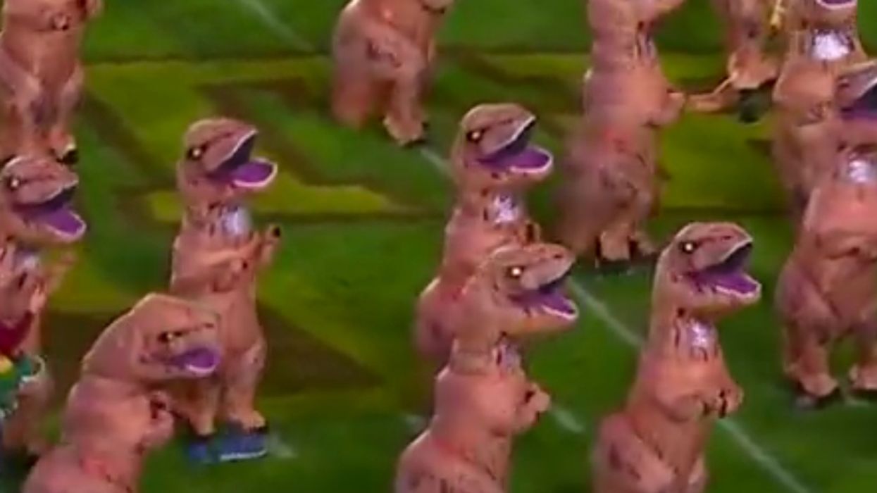 Viral Video Of T. Rexes Dancing To 'Jurassic Park' Theme At Football Game Inspires Some Epic Jokes 😂