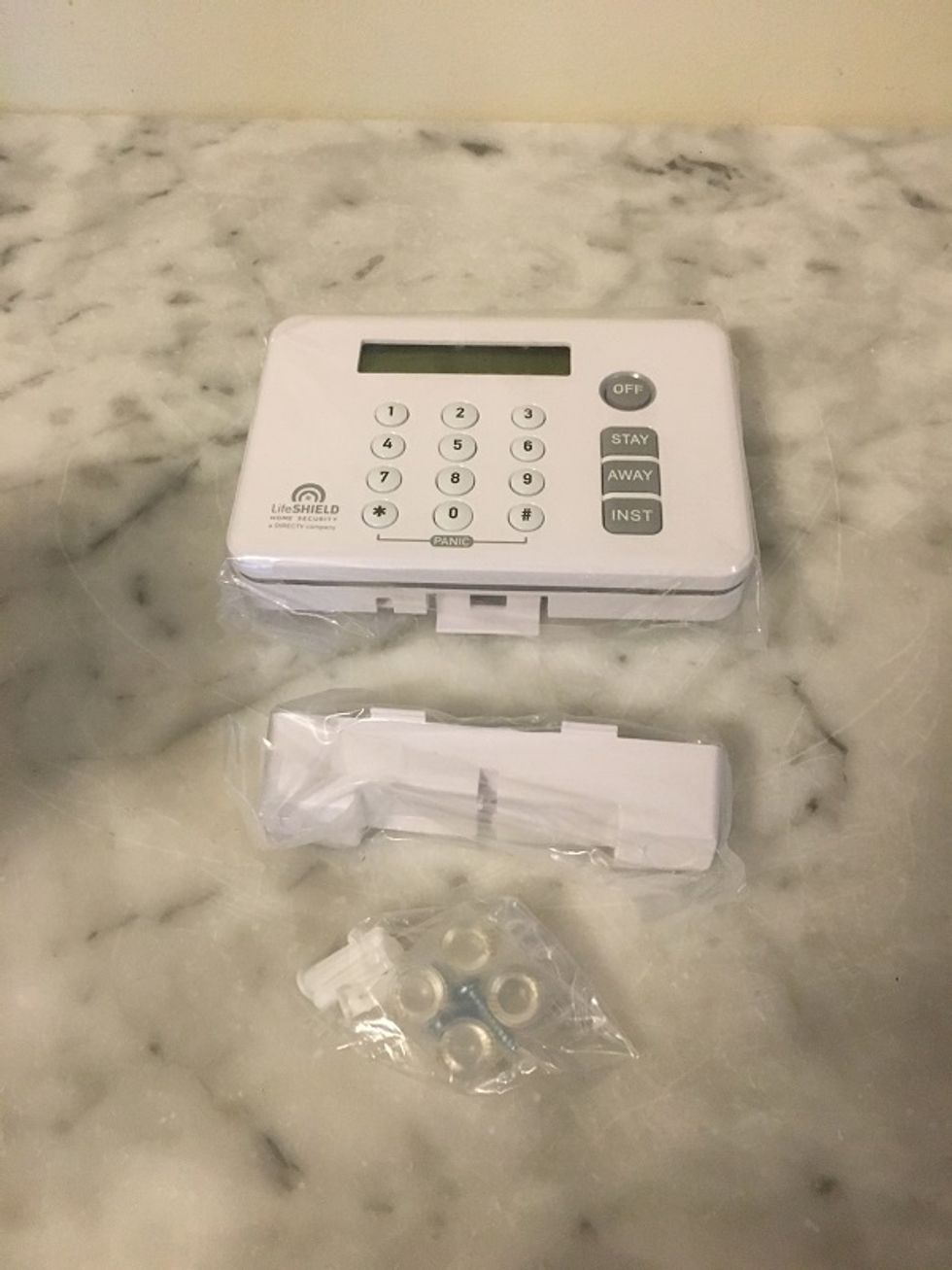 Photo of Lifeshield control panel on a counter in the packaging.