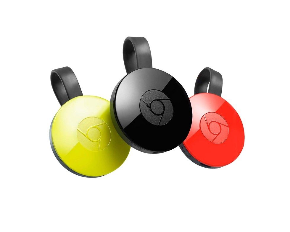A black, red and yellow Google Chromecast against a white background