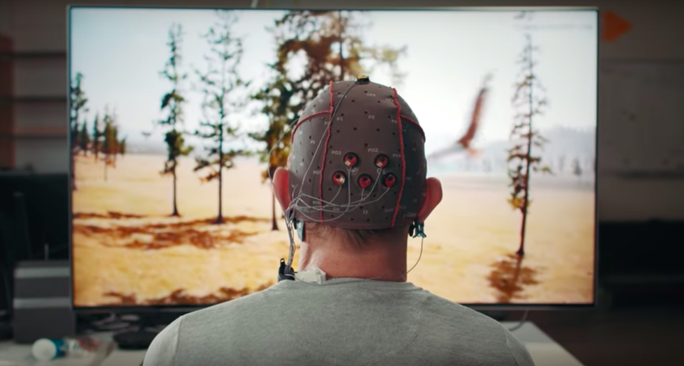 photo of a man wearing a headet to control his tv