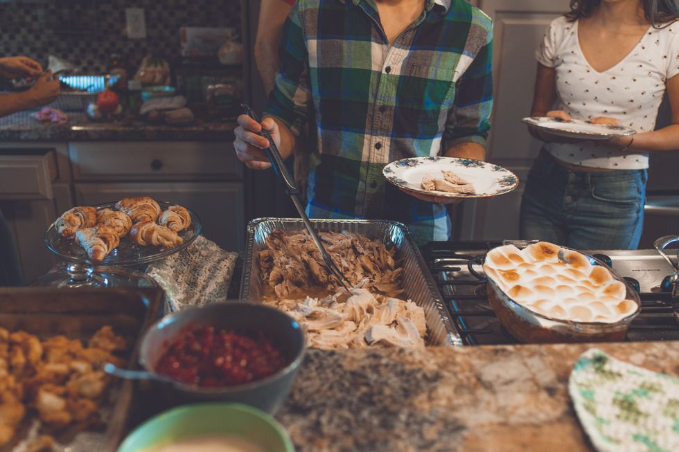 https://www.pexels.com/photo/person-picking-food-on-tray-1631893/