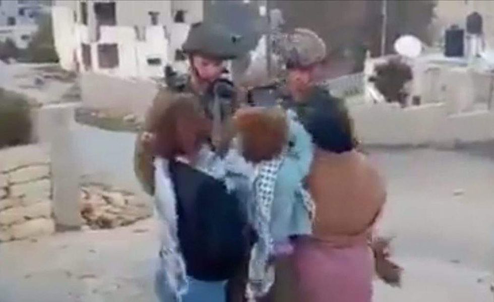 Israeli Soldier Slapped In Face Kicked By Palestinian Teen Girl His