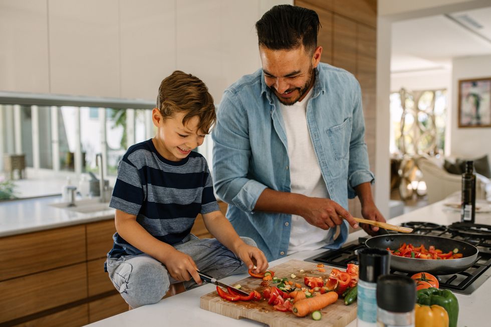 A father and son making a meal together