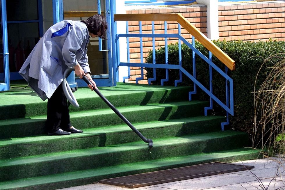 Woman cleaning steps