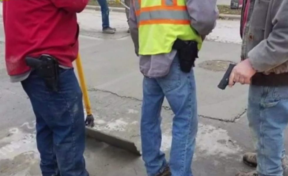 Photo shows construction workers carrying guns on the job — and they've