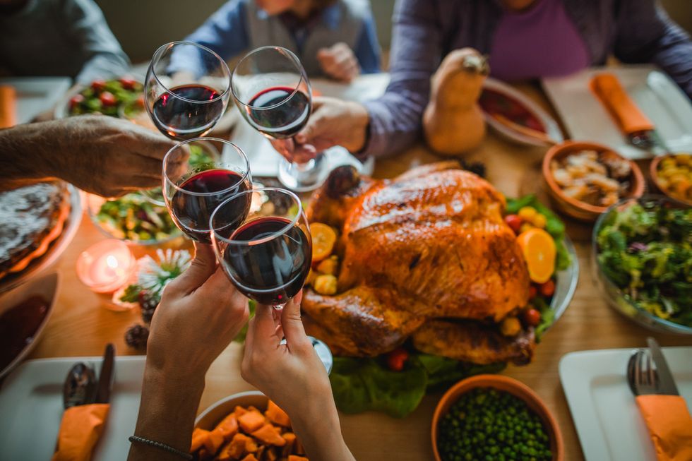 a photo of a dinner table with wine glasses