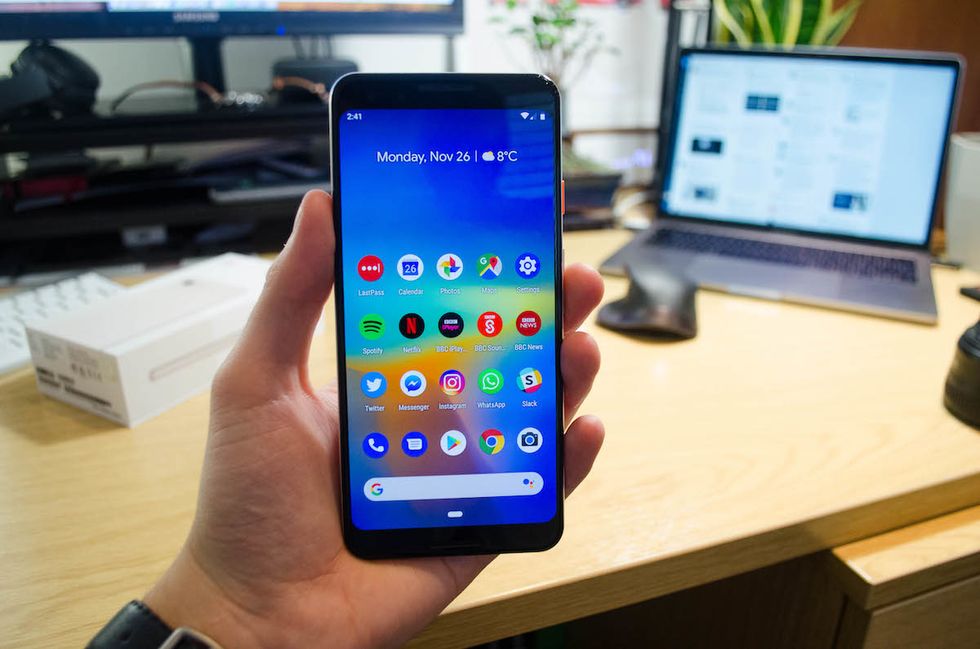 Picture of a hand holding a Google Pixel 3 smartphone