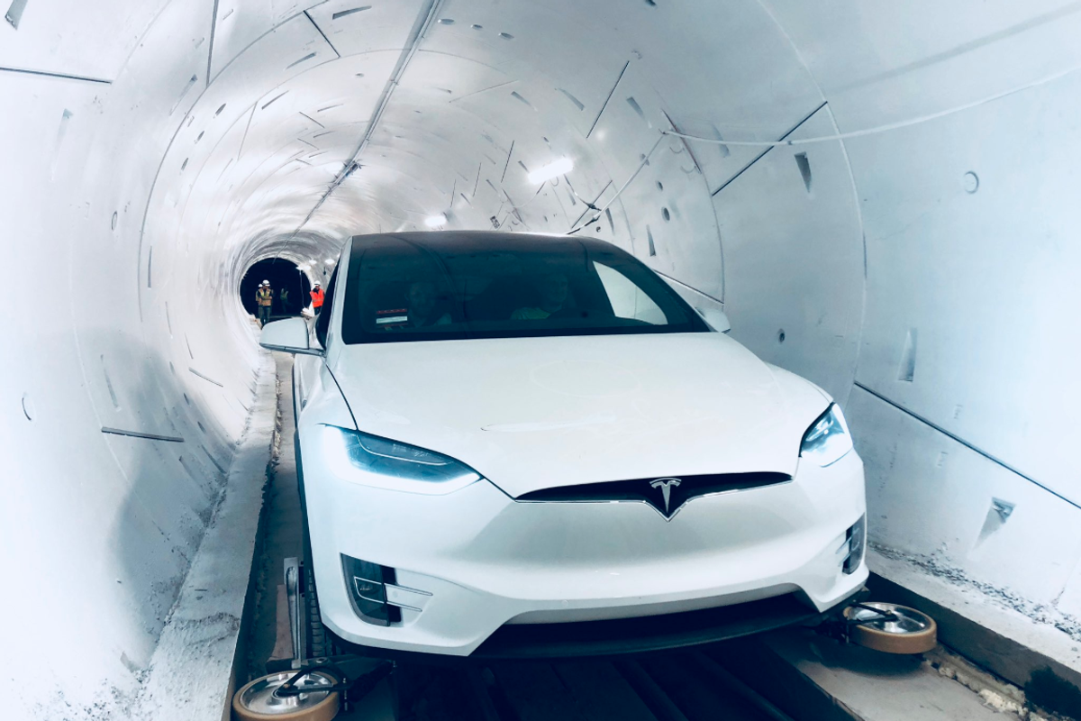 a photo of a Tesla in a boring tunnel