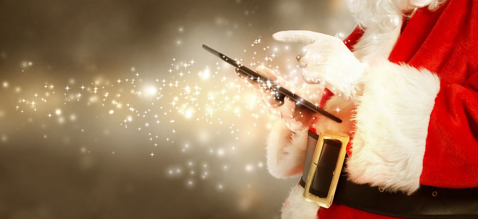 Santa typing on a Tablet