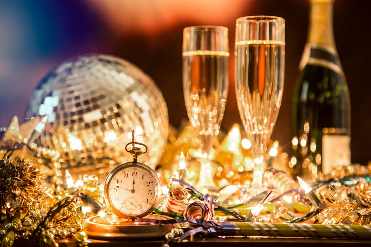 a photo of two champagne glasses and a stop watch