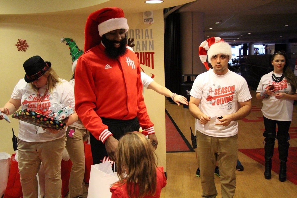 Santa Jermaine hands out gifts for the Houston sports scene