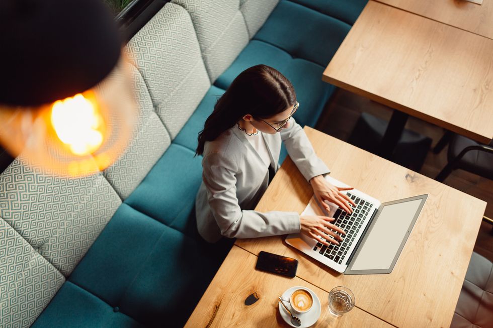 an overhead shot of a woman on a laptop