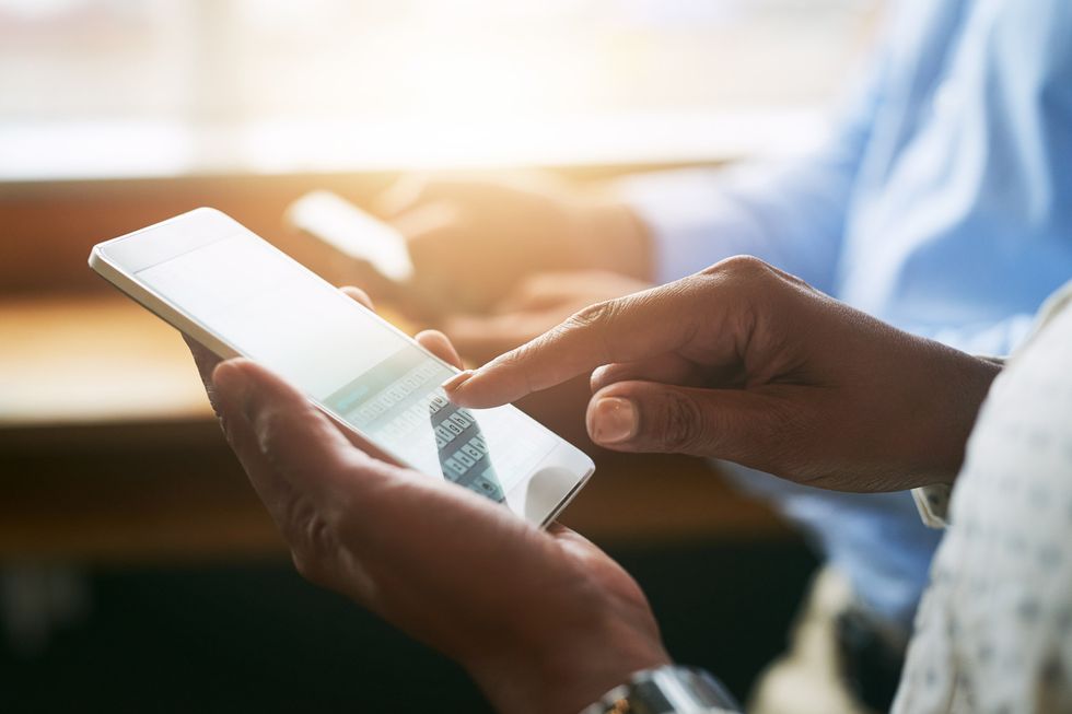 a person using their finger on a smartphone