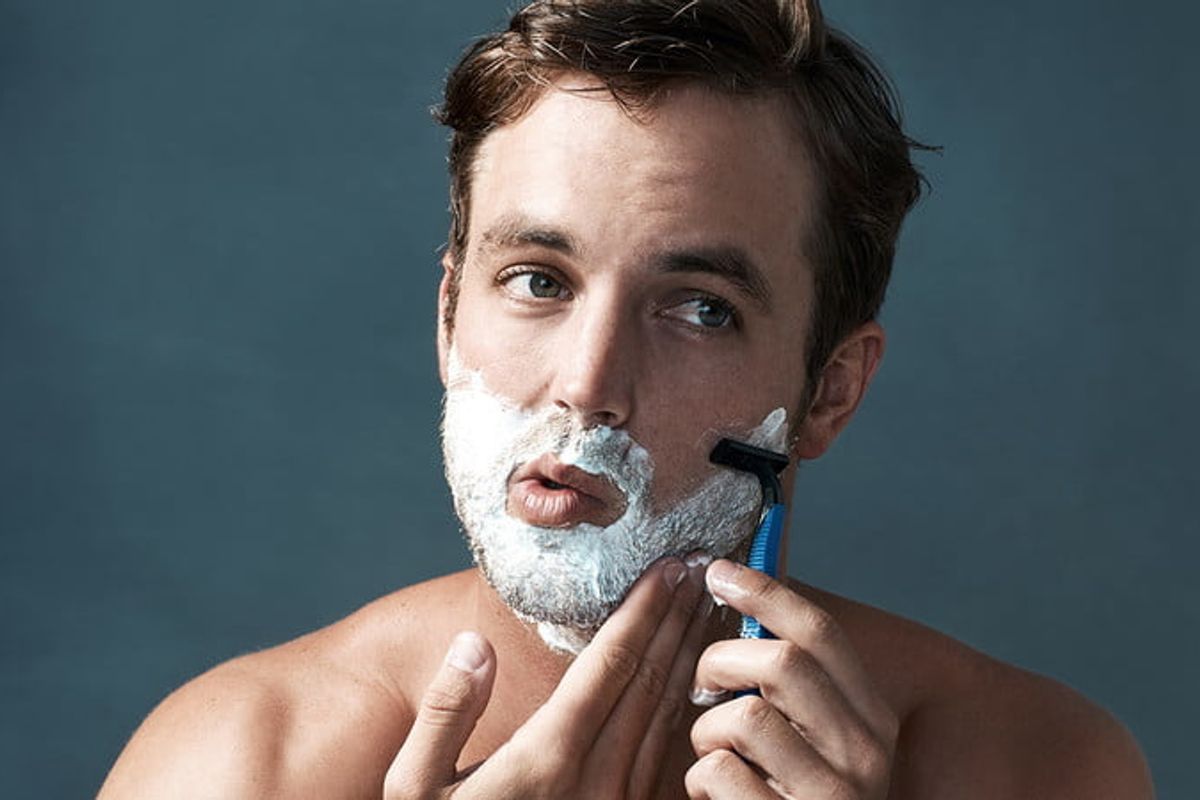Man shaving his beard