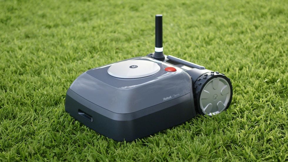 A photo of the Terra robot mower from iRobot that keeps your lawn clipped while you relax and enjoy the summer sun