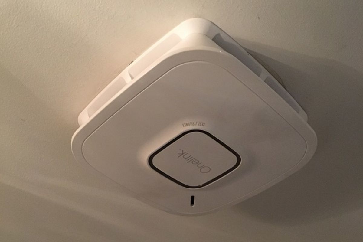 photo of First Alert Onelink Smart Smoke + Carbon Monoxide Alarm on a ceiling.