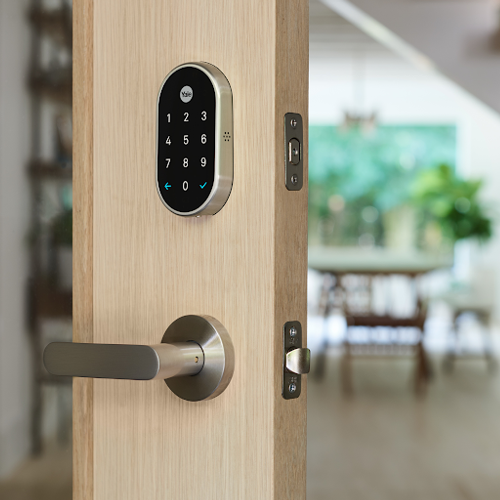 A photo of the Nest x Yale smart lock, which works with Google Assistant, opening the door with just your voice\u200b