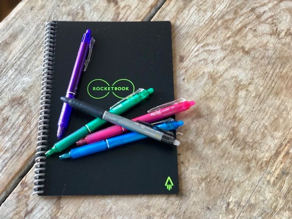 The Rocketbook Everlast notebook with multiple colors of pens