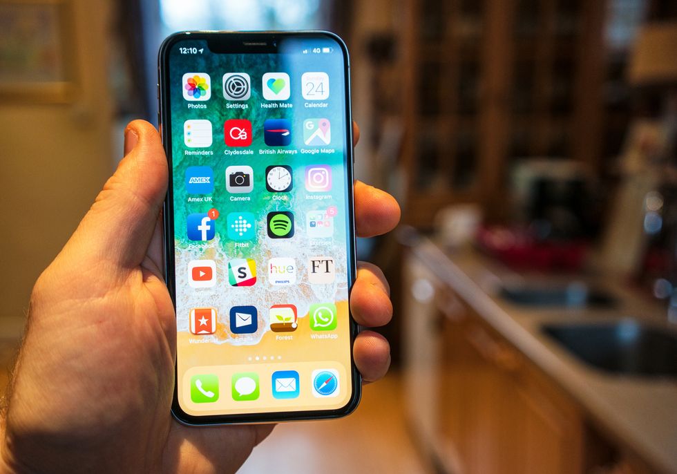 Photo of a smartphone filled with multiple apps