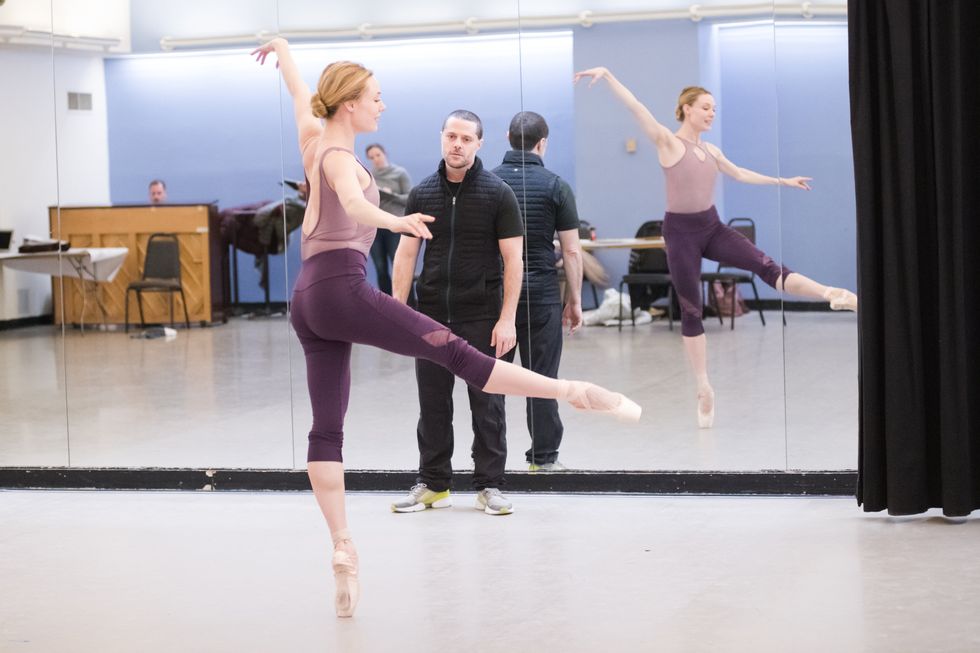 Josh Bergasse watches Sara Mearns on pointe in a developpe front