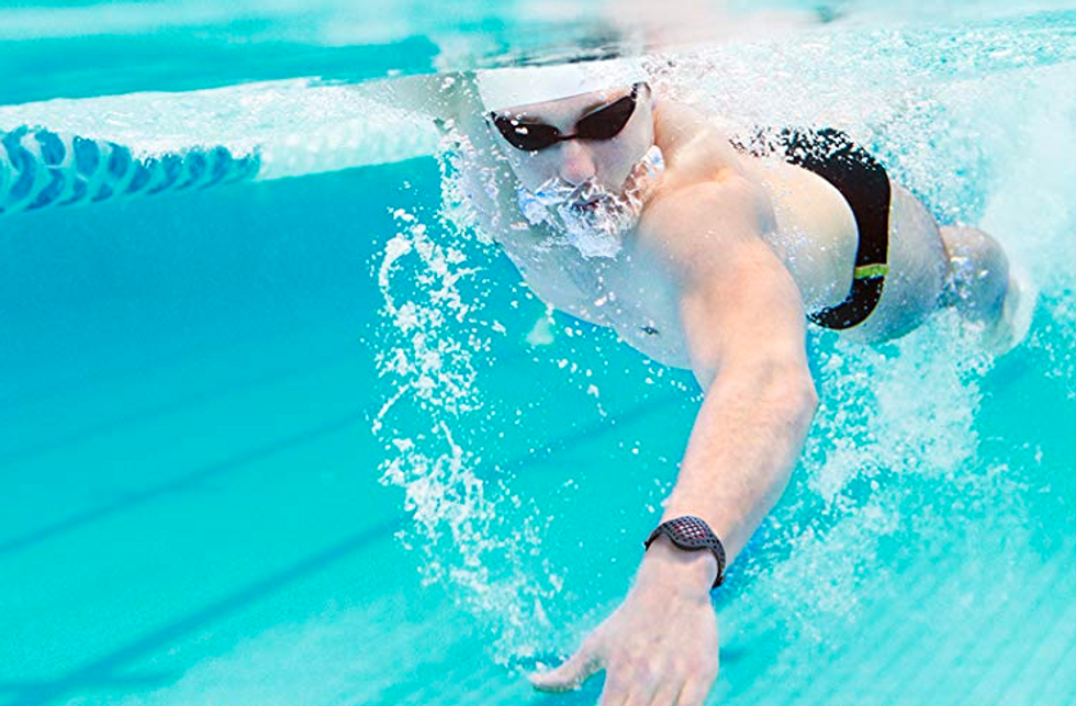 Photo of a man swimming with a Moov Now fitness tracker