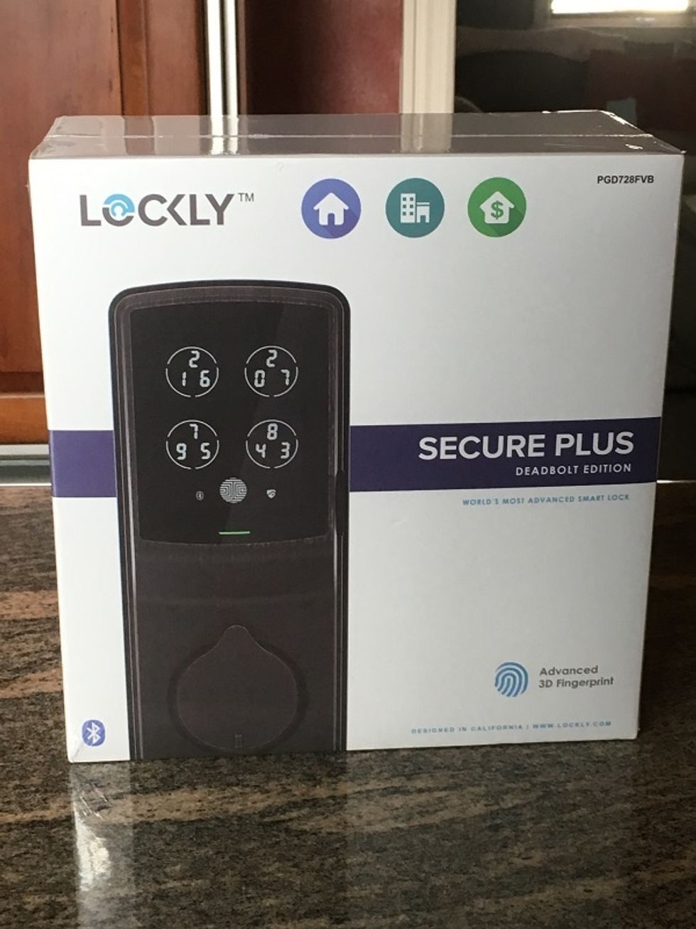 a photo of Lockly Secure Plus Deadbolt Smart Lock on a countertop
