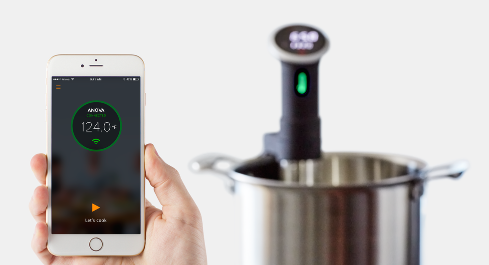 A photo of \u200bthe Anova sous vide device, which lets you cook through a smartphone app in water