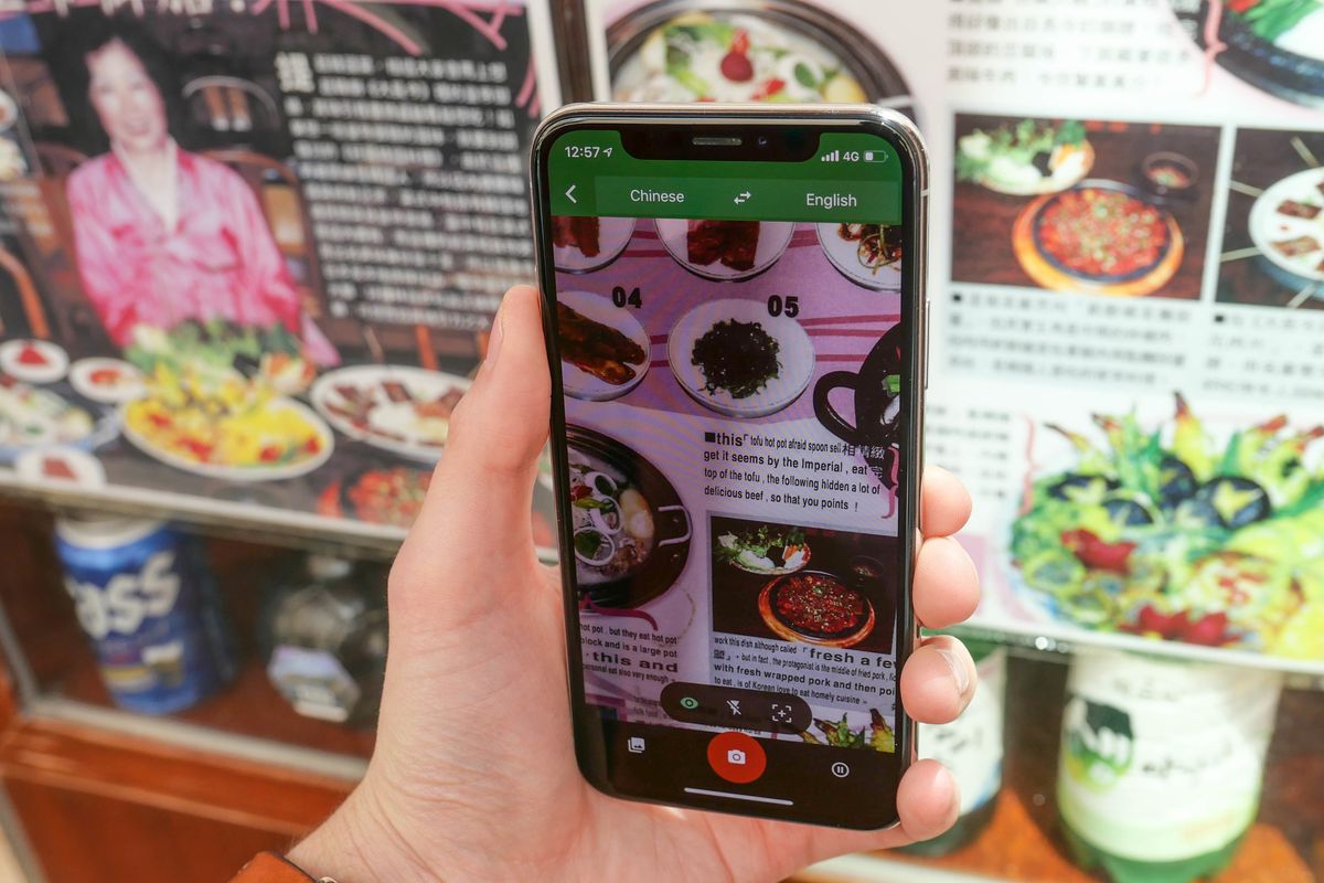 Photo of a smartphone all being used to translate a Chinese menu in Hong Kong