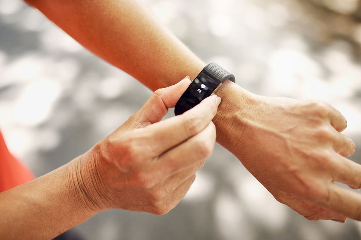 Photo of a person wearing a fitness tracker