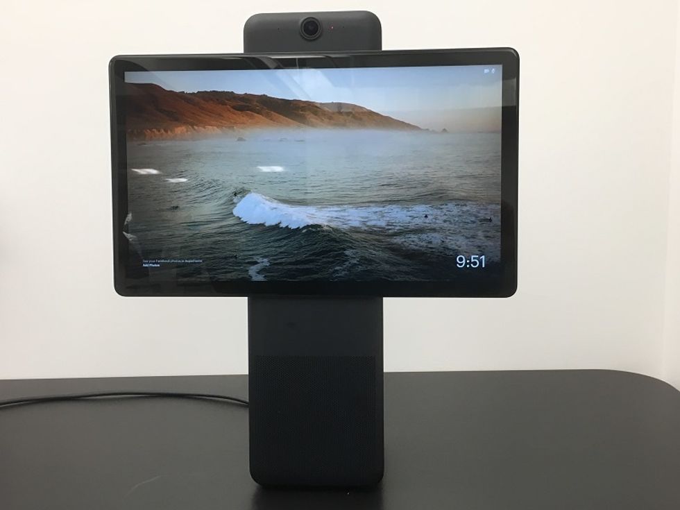 a photo of meta portal plus horizontally showing screensaver