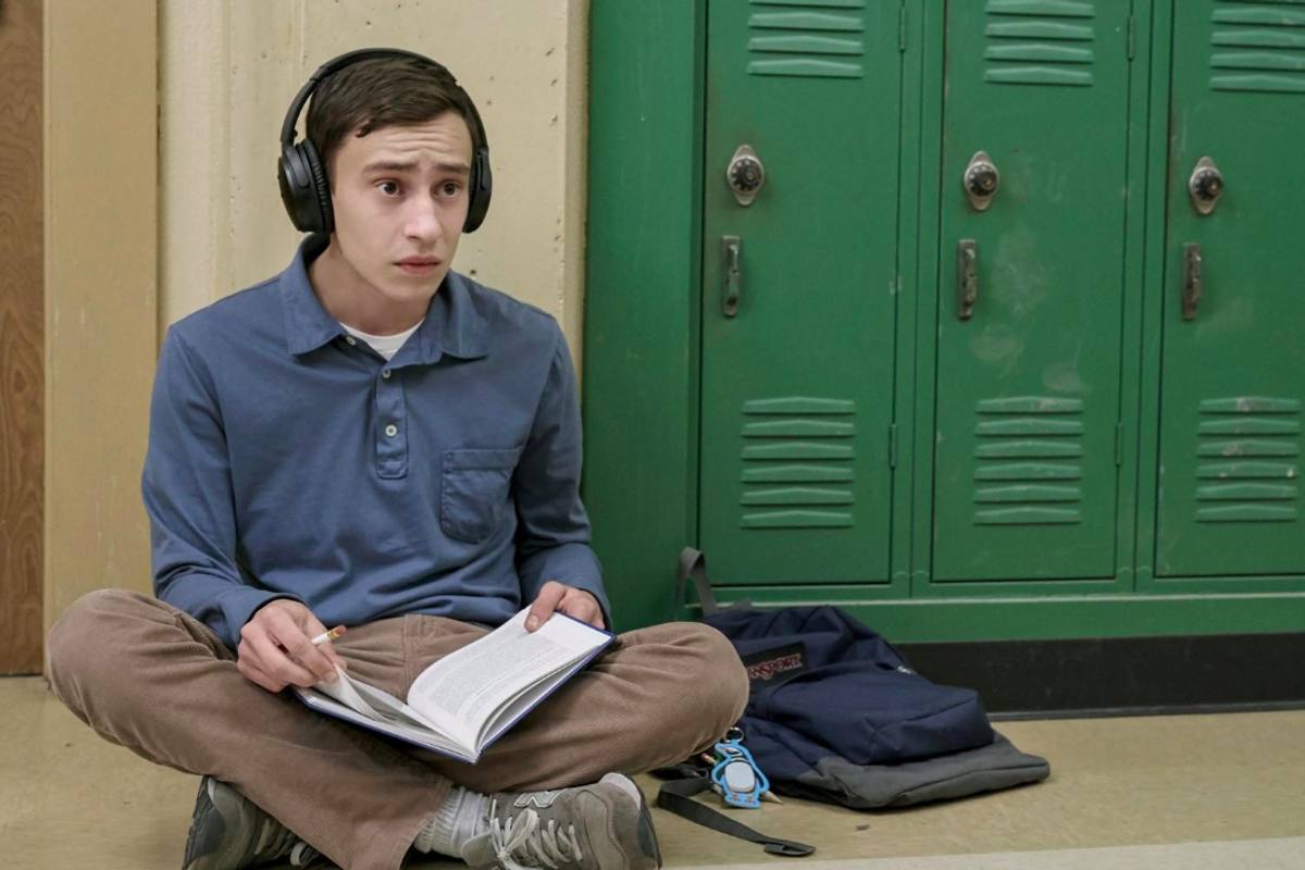 Sam from atypical sitting with headphones