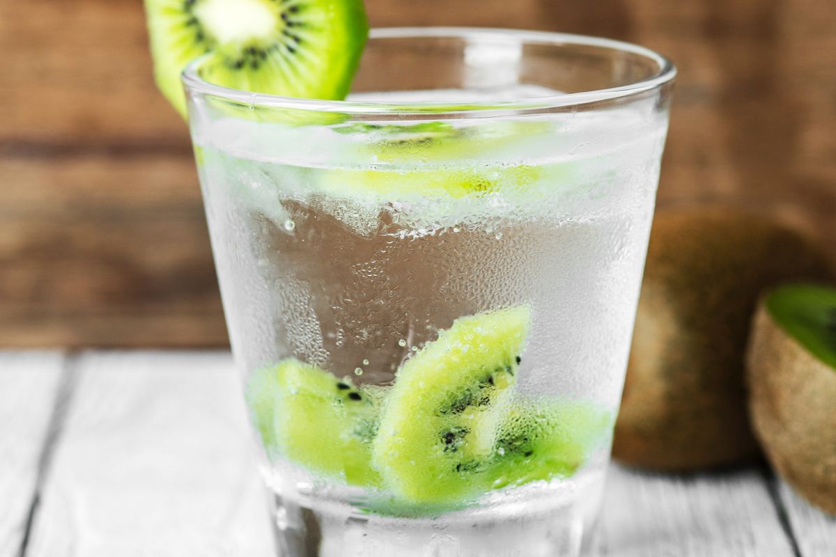 Kiwis in a clear glass with water