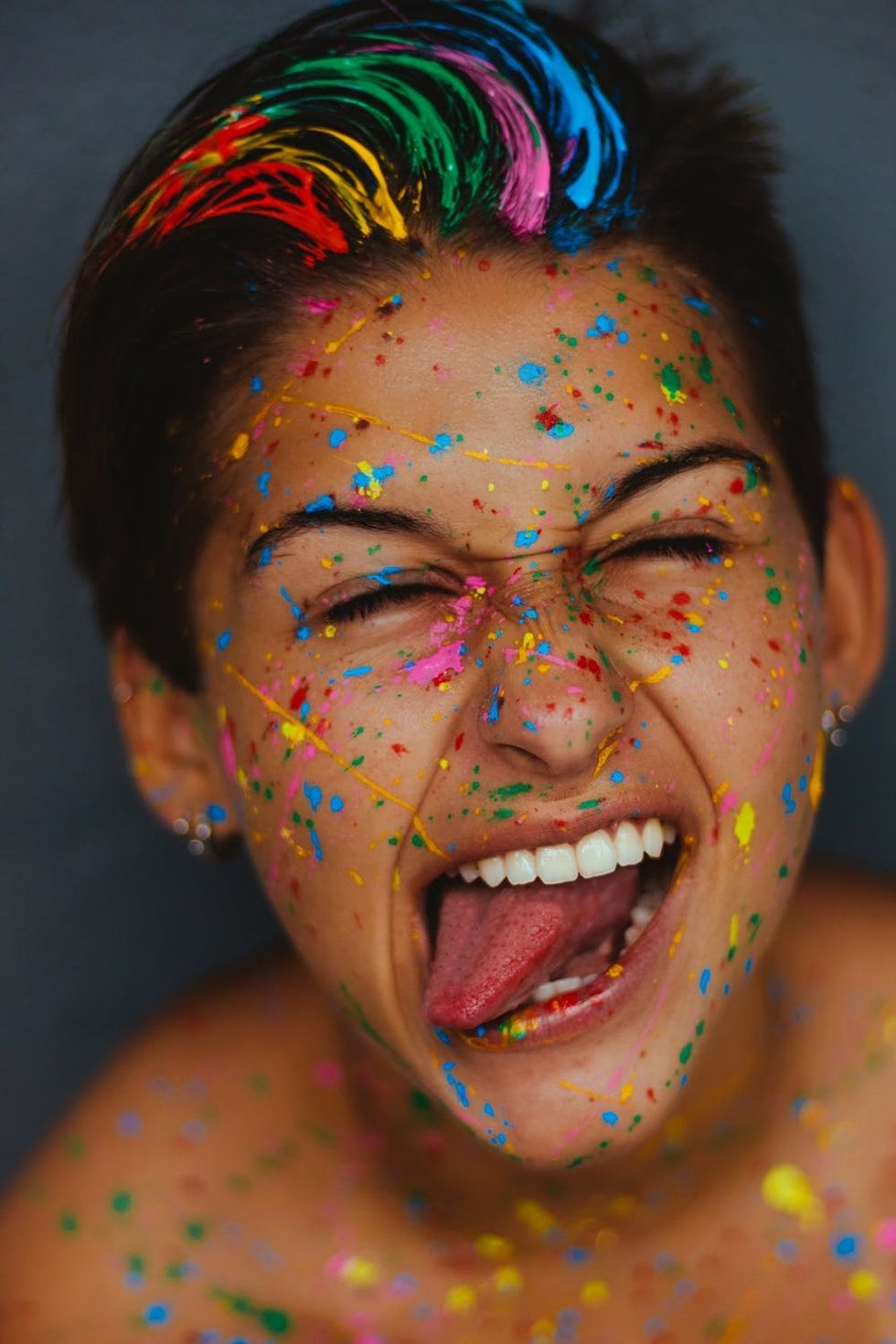 https://www.pexels.com/photo/woman-s-face-with-color-splatters-1937301/