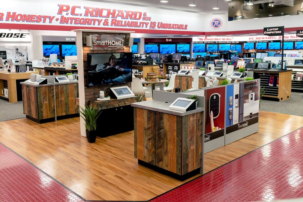 A photo of the inside of a P.C. Richard & Son store, which sells smart home devices alongside TVs