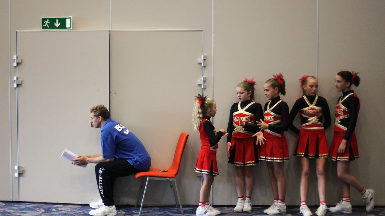 Watch South Carolina airport worker dance with cheer squad during flight delay