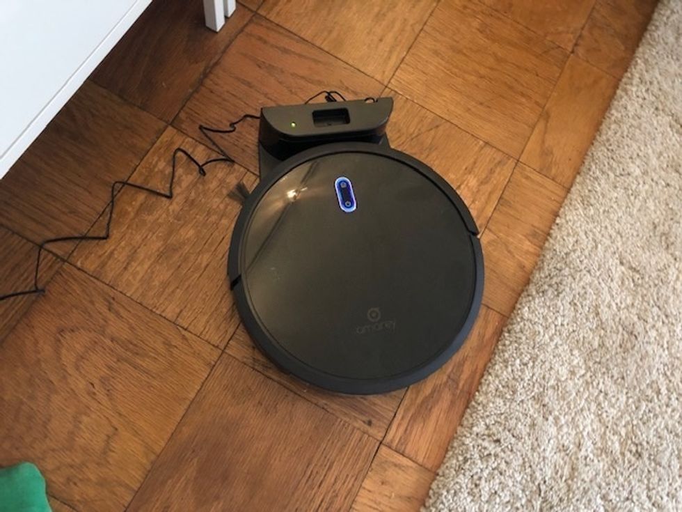 A photo of the Amarey A800 robot vacuum on its charging station