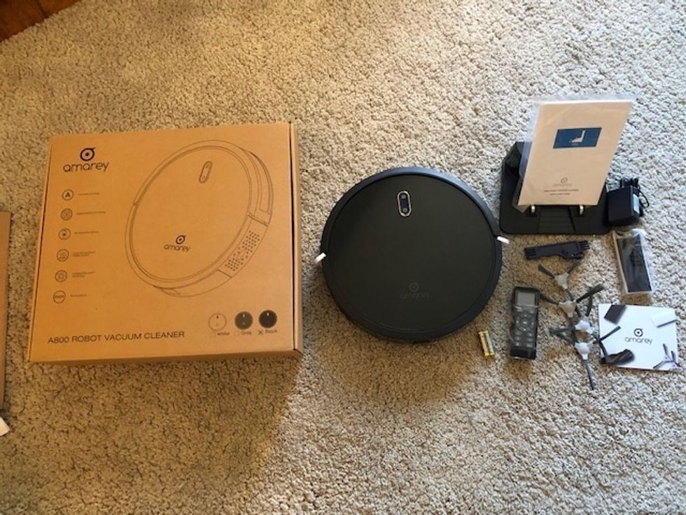 A photo of the Amarey A800 and everything that comes in the box including spare sweepers