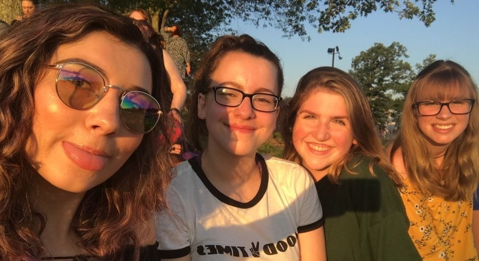 friends taking selfie at sunset
