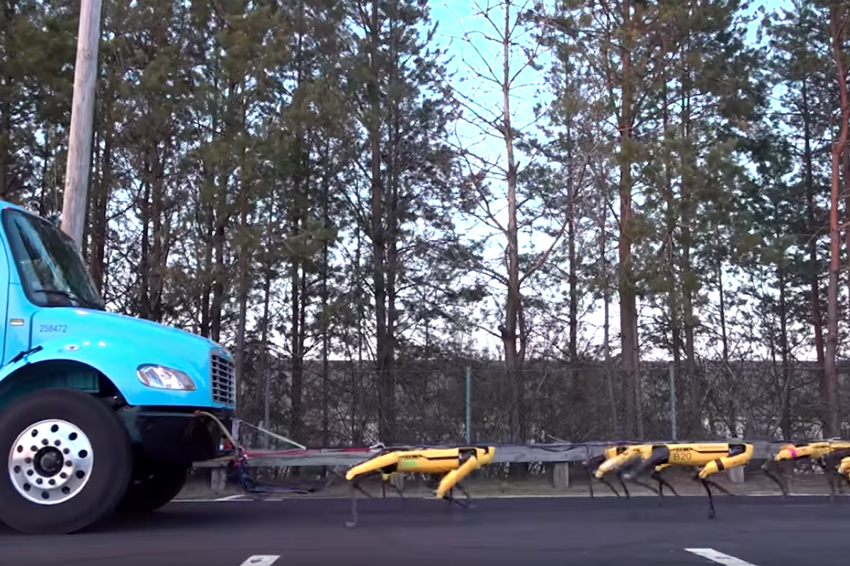 Photo of Boston Dynamics robots pulling a truck