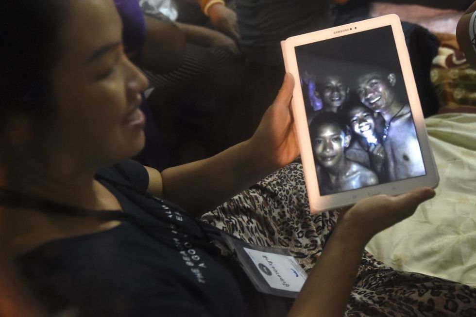 The coach of the trapped Thai soccer players is being called a hero for his selfless acts.