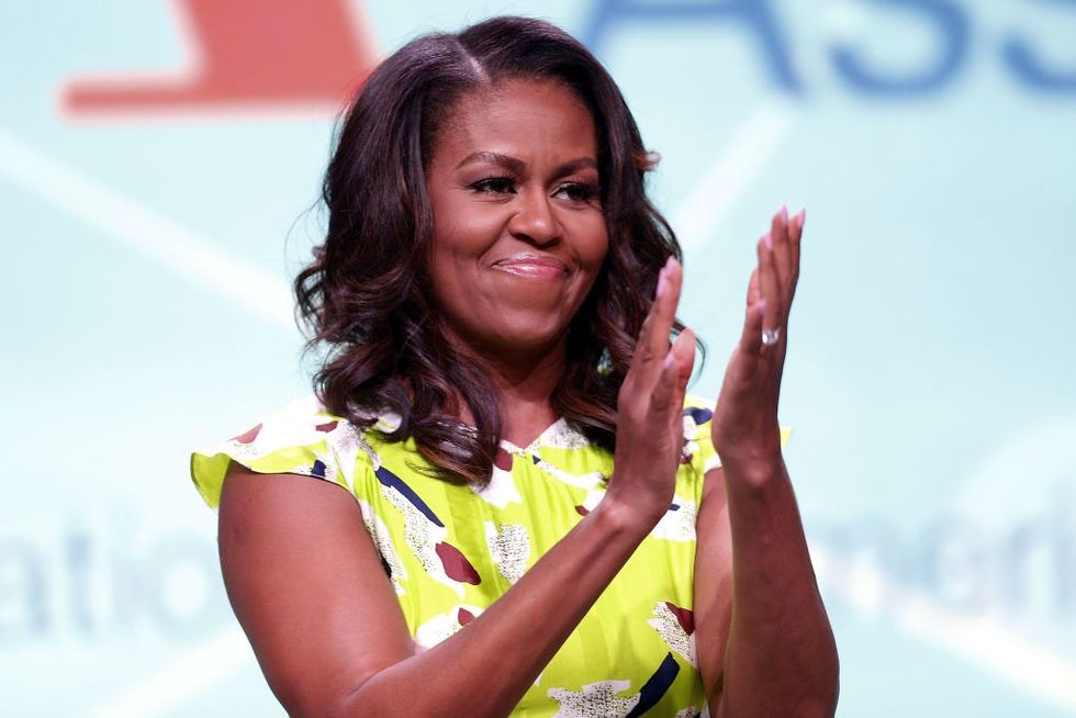 Michelle Obama just paused her book tour to officiate this couple’s wedding.