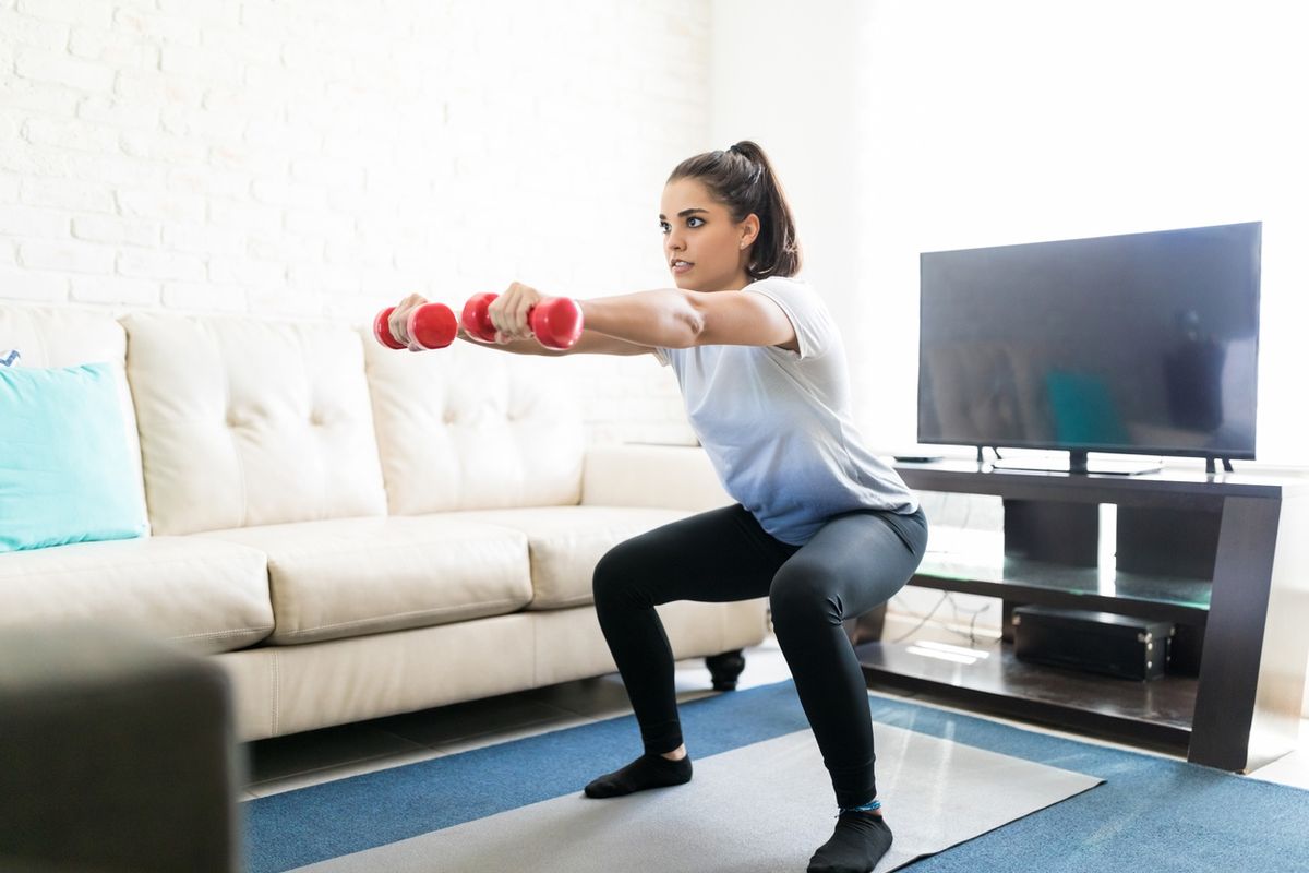 Photo of a woman exercising at home