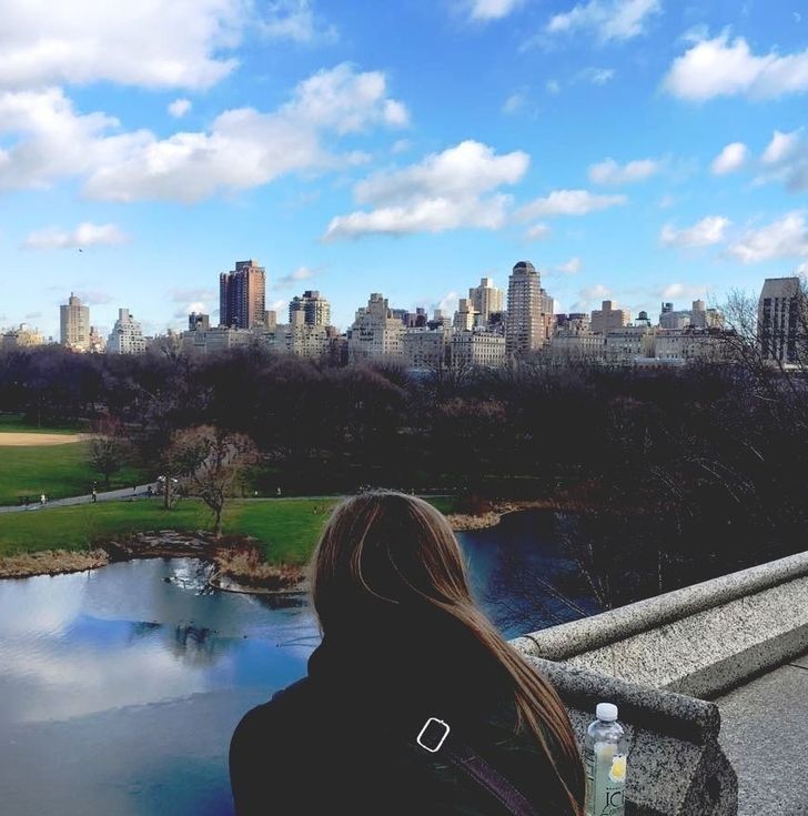 woman looking out at new york city skyline
