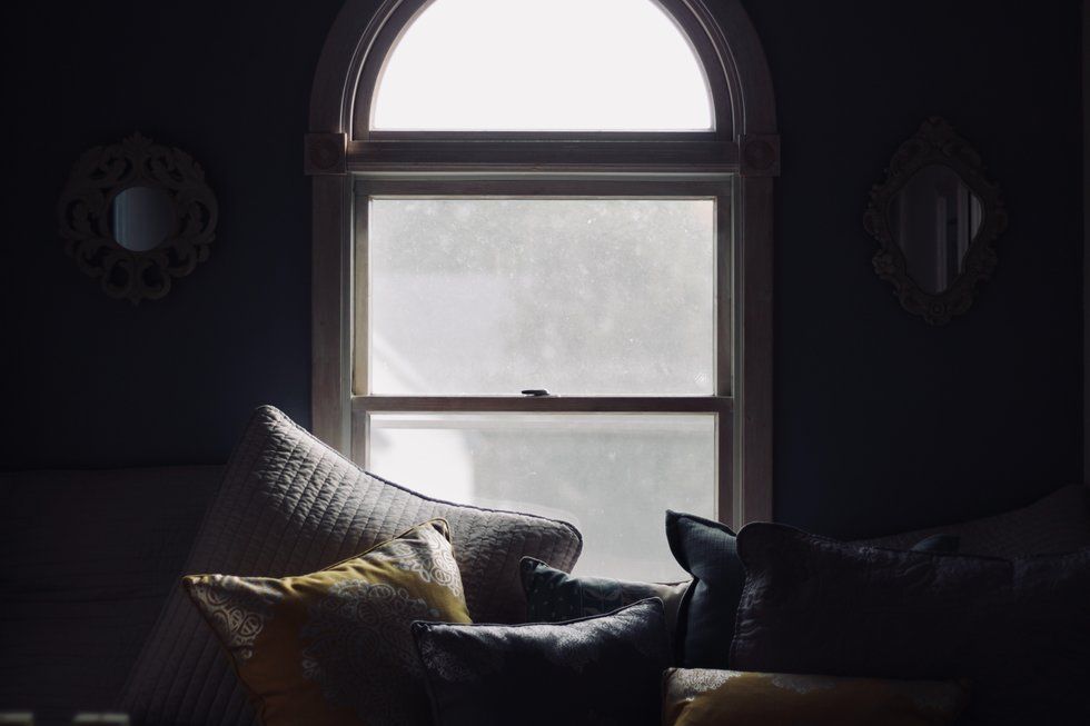 Throw pillows set against a bright window
